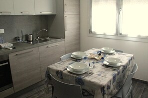 Fridge, microwave, coffee/tea maker, cookware/dishes/utensils