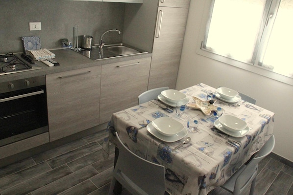 Fridge, microwave, coffee/tea maker, cookware/dishes/utensils