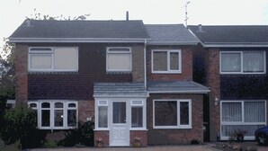 A two-story residential building with a front door, windows, and a garage. - Professional Bed & Breakfast en-suite double rooms £80 per night per room. (Warwick)
