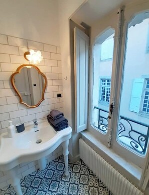 Bathtub, hair dryer, towels, soap