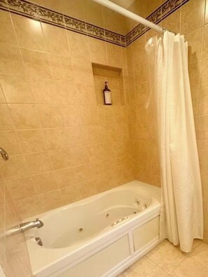 Combined shower/tub, hair dryer, towels, soap