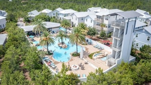 A resort with multiple buildings, a central swimming pool, and surrounding greenery. - Current Situation| 4 Bdrm w/ 3 Kings | Heated Pool | Golf Cart (Santa Rosa Beach)