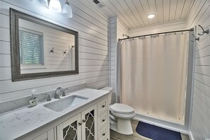 Combined shower/tub, hair dryer, towels, toilet paper