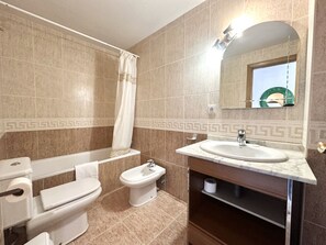 Bathtub, hair dryer, towels