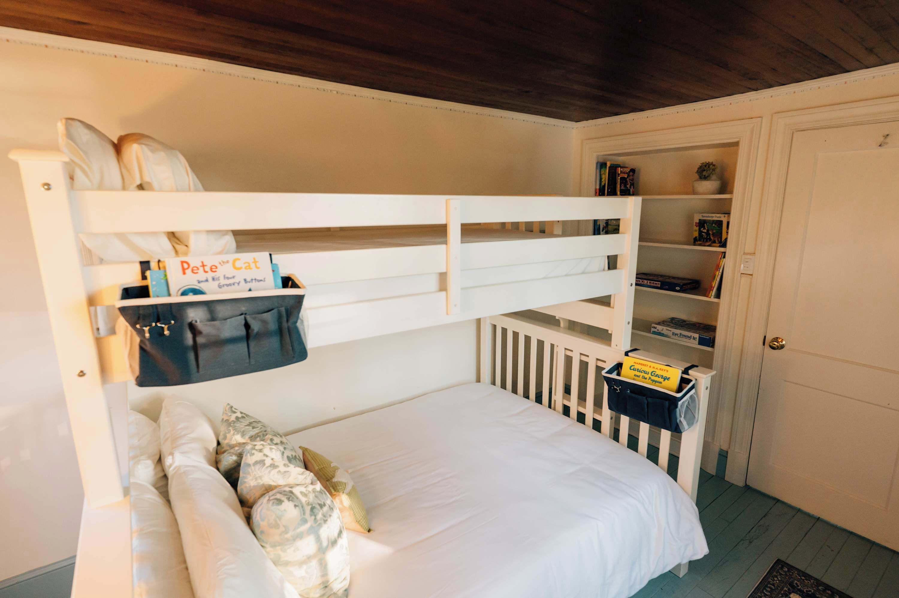 Books, games, and cozy reading pockets help create quiet moments between days on the water.