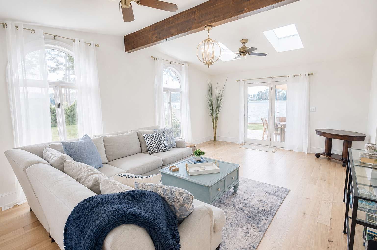 Vaulted ceilings, natural light, and waterfront views create a welcoming space to relax after a day on the river. 