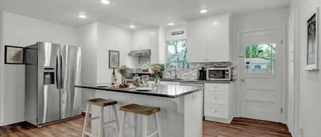Coffee/tea maker, fridge, microwave, oven