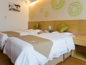 A hotel room with two beds, a wooden headboard, and a wall with circular patterns. - Greentree Inn Bozhou Lixin District Huishang Market (Bozhou)