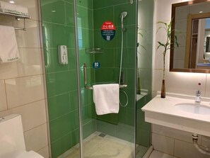 A modern bathroom with a glass-enclosed shower, a sink, and a mirror. - Greentree Inn Huainan Jinjialing Road Oriental General Hospital (Huainan)