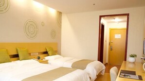 A hotel room with two beds, a desk, and a chair. There is a door leading to another room. - Greentree Inn Shaoxing Xinchang Dafou Express Hotel (Shaoxing)