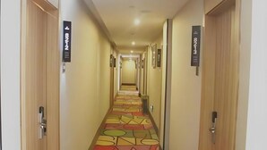 A hotel hallway with doors labeled 8212 and 8213. - Shell Shanghai Chedun Yingshi City Yingshi Road Hotel (Shanghai)