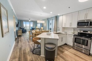 Fridge, microwave, oven, stovetop - Oceanfront Elegance: Renovated Orange Beach Condo (Orange Beach)