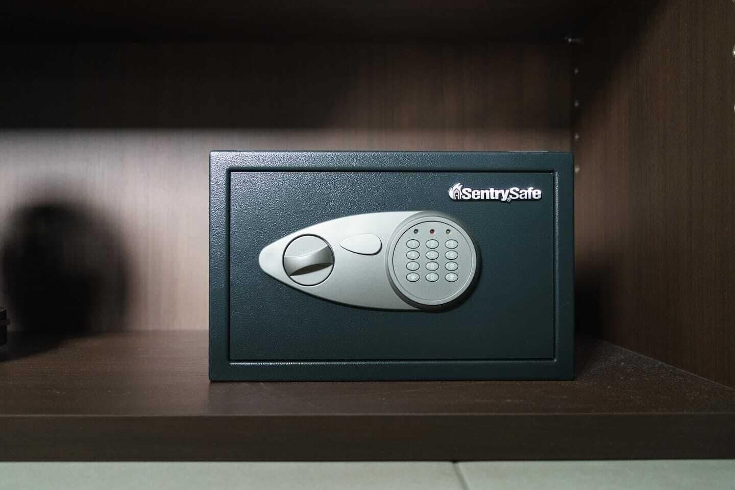 A black safe with a keypad and a keyhole, labeled "SentrySafe."