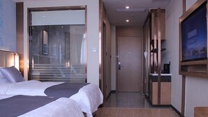 A hotel room with two beds, a TV, and a view of a staircase. - Greentree Eastern Liaocheng Linqing City Yandian Hotel (Liaocheng)