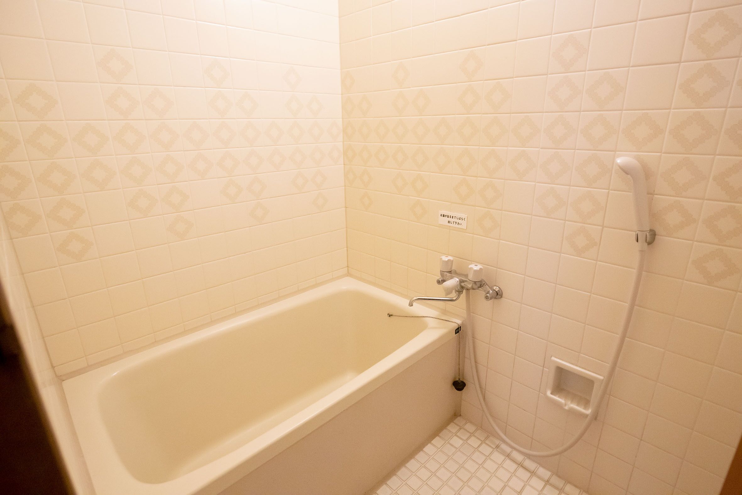 A bathroom with a bathtub, a shower, and a toilet.
