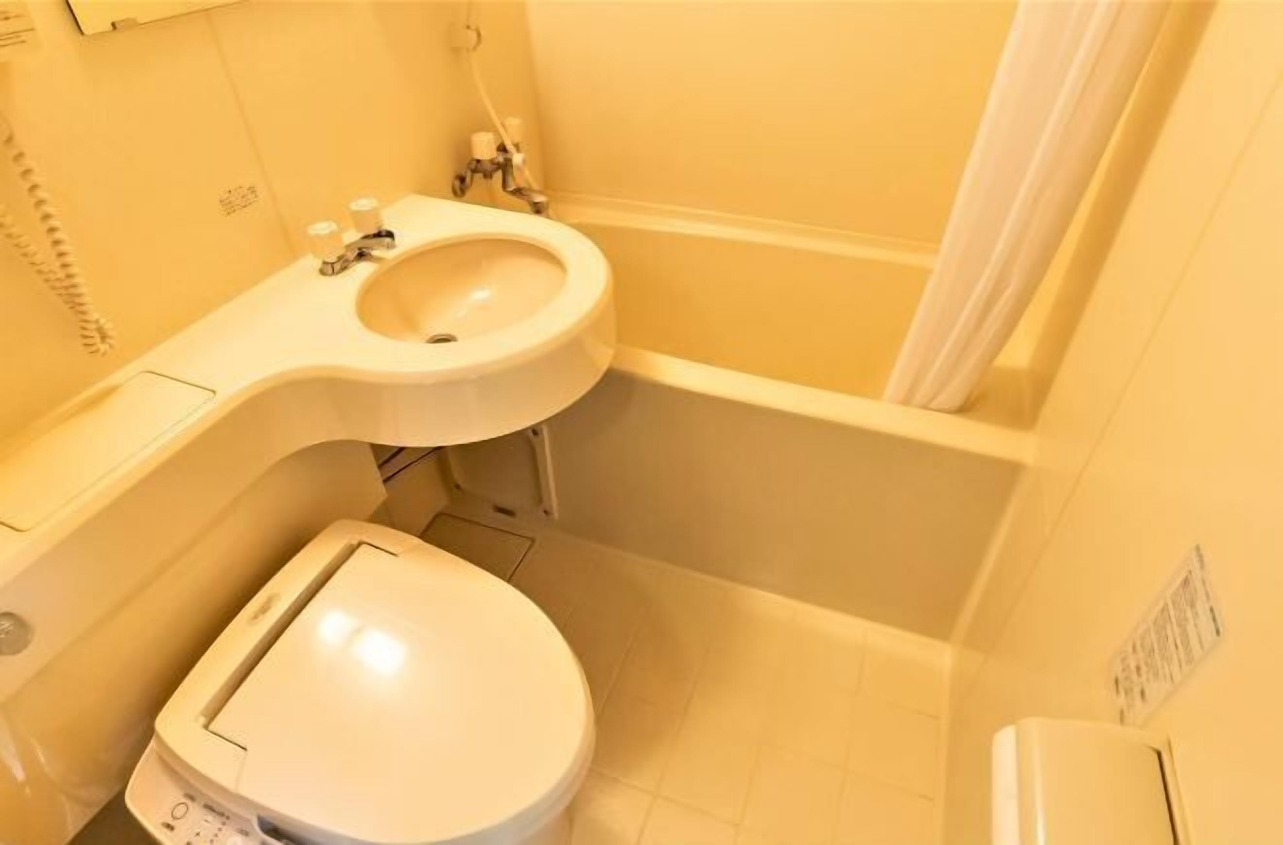 Bathroom | Hair dryer, slippers, towels, shampoo