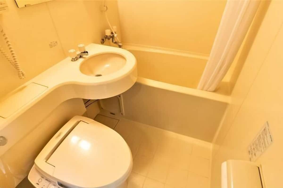 Bathroom | Hair dryer, slippers, towels, shampoo