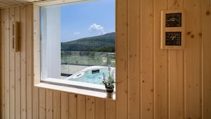 A wooden cabin with a large window overlooking a hot tub and a mountainous landscape. - Villa Top Hill,heated pool,Jacuzzi,Sauna,5 en-suite bedrooms,Media room (Tugare)