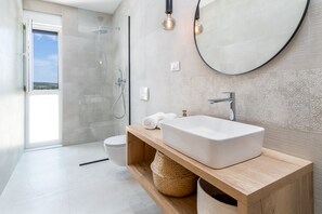 Bathtub, hair dryer, towels, soap