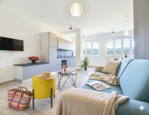 Apartment, 2 Bedrooms, Garden Area | Living area | Flat-screen TV