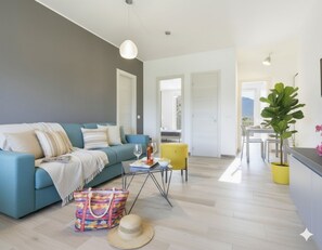 Apartment, 2 Bedrooms, Garden Area | Living area | Flat-screen TV