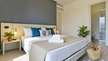 Apartemen, 2 kamar tidur, teras | 2 kamar tidur dan didekorasi berbeda-beda