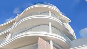 A modern building with curved balconies and large windows. - iloftmalaga Panoramica II - El Higueron (Fuengirola)