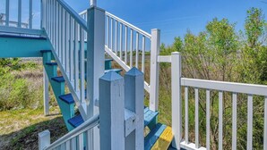 A staircase with white railings and blue steps leading to a platform. - Renovated 3 BR, 2 BA w/Marsh Views & Short Walk to Beach (Garden City Beach)