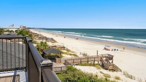 A beach with wooden walkways, a gazebo, and a clear view of the ocean. - Penthouse Oceanfront Villa at Inlet Point on Litchfield Beach (Pawleys Island)