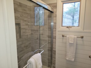 Combined shower/tub, hair dryer, towels, toilet paper