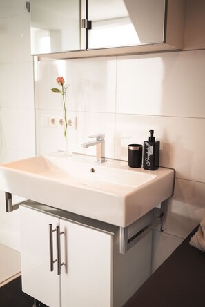 Bathtub, hair dryer, towels, soap