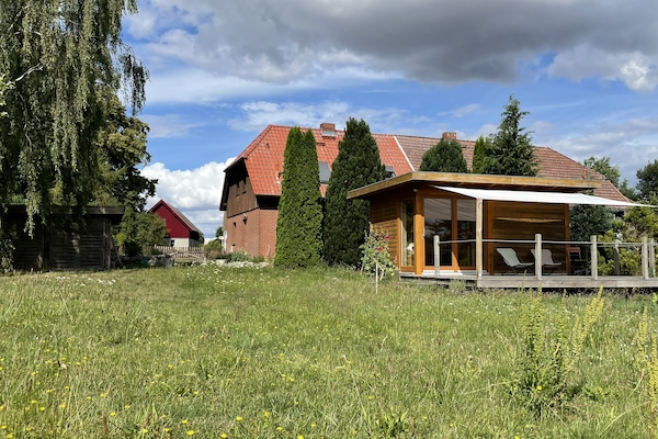 Terrasse Sauna im Hintergrund Ferienhaus DHH