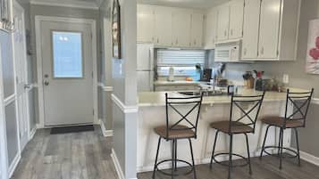 Coffee/tea maker, fridge, microwave, oven