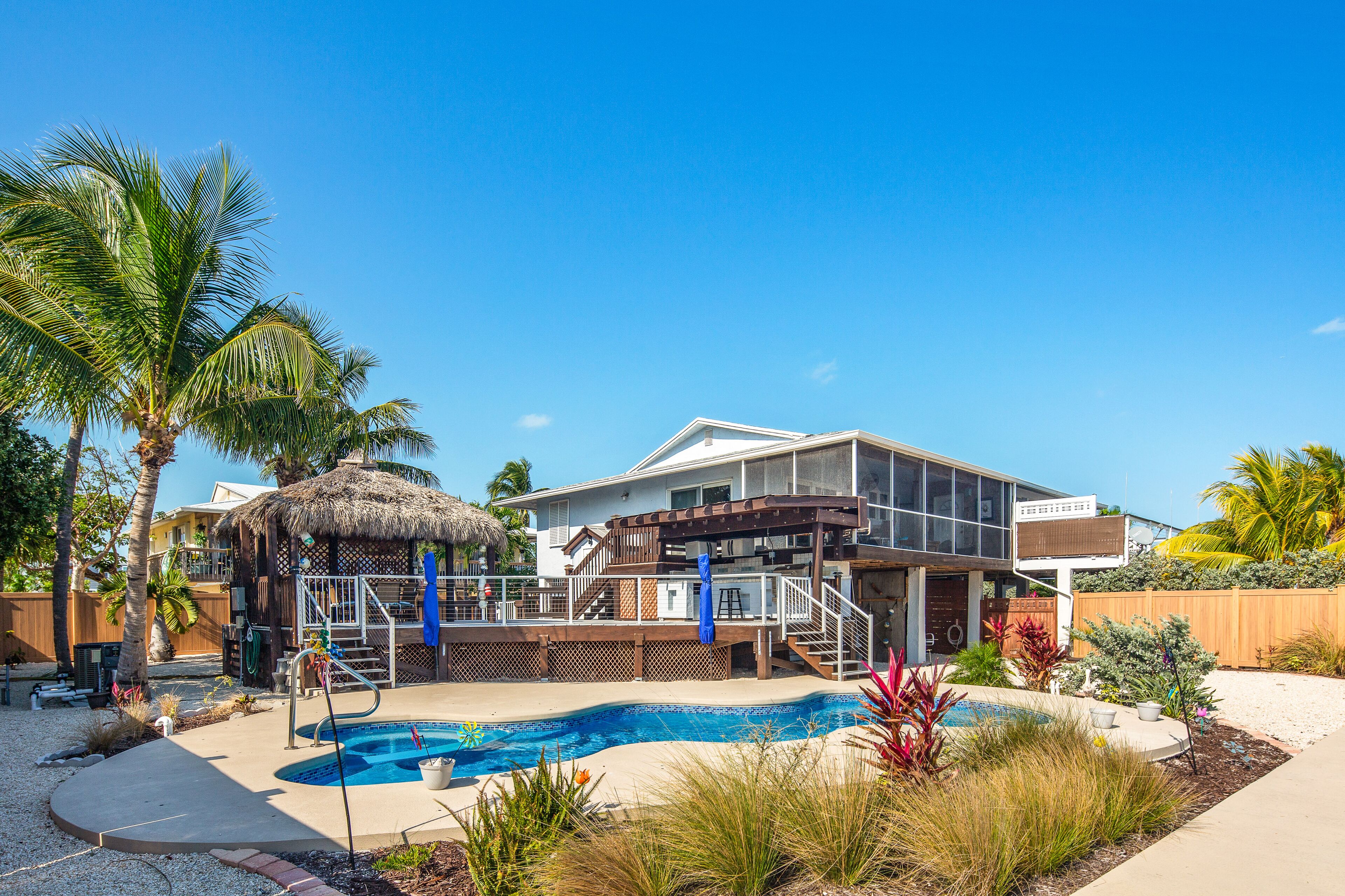 Dog-friendly oceanfront home with private pool, screened porch & outdoor kitchen