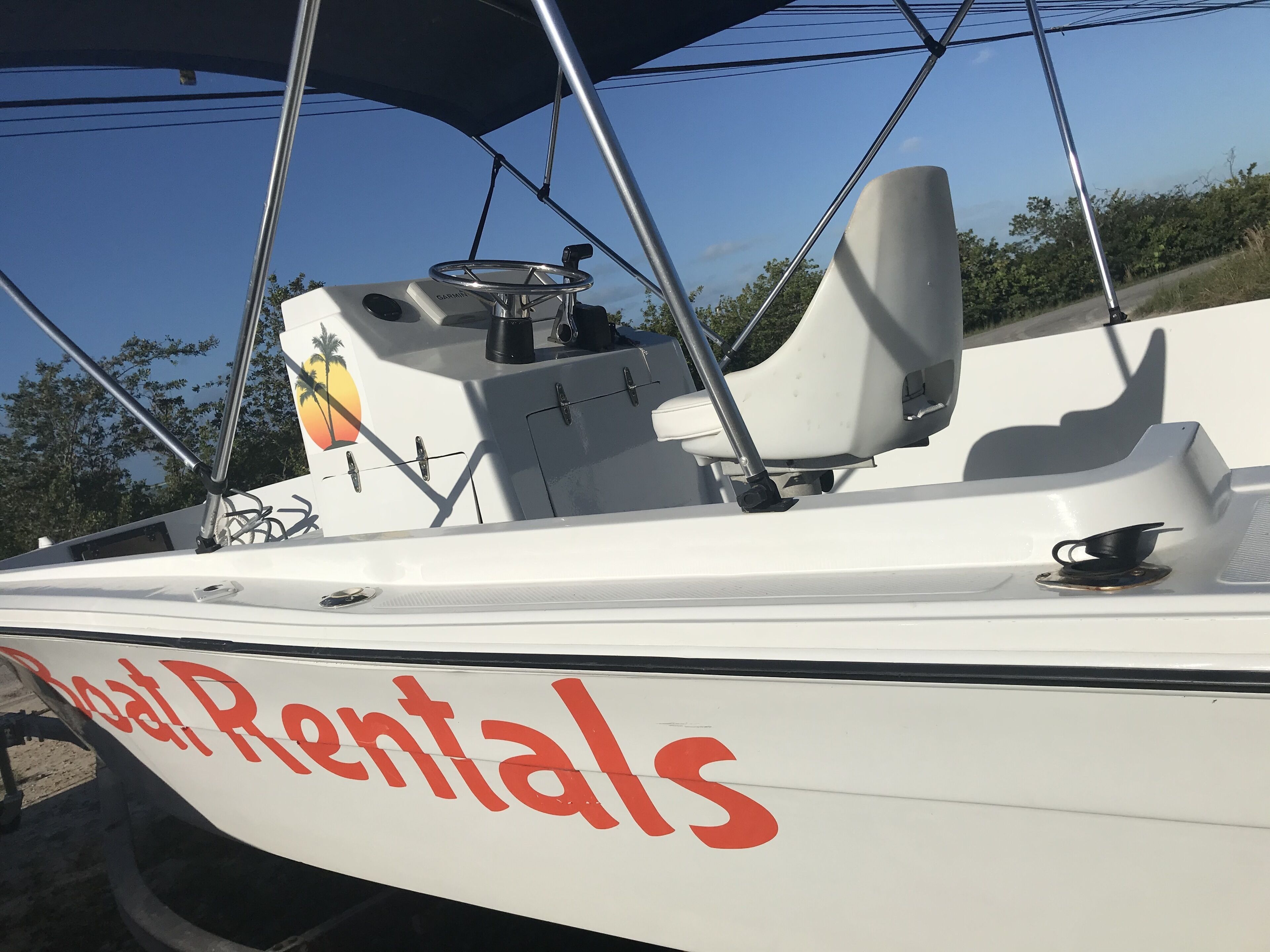 A boat with the text "Boat Rentals" on its side.