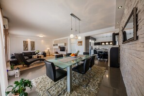 Villa, Multiple Beds | Living room | 30-inch TV with digital channels, fireplace