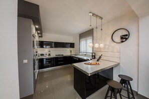 Villa, Multiple Beds | Private kitchen | Fridge, microwave, oven, stovetop