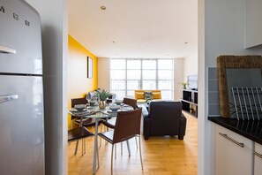 Comfort Apartment | Living area | Flat-screen TV