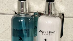 Two bottles of Cole & Lewis London products, one blue and one white, on a tiled wall. - King Size bed - Free Parking - 5 min to Centre (Lincoln)