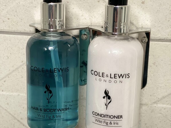 Two bottles of Cole & Lewis London products, one blue and one white, on a tiled wall. - King Size bed - Free Parking - 5 min to Centre (Lincoln)