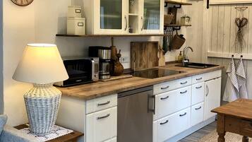 Fridge, microwave, stovetop, coffee/tea maker