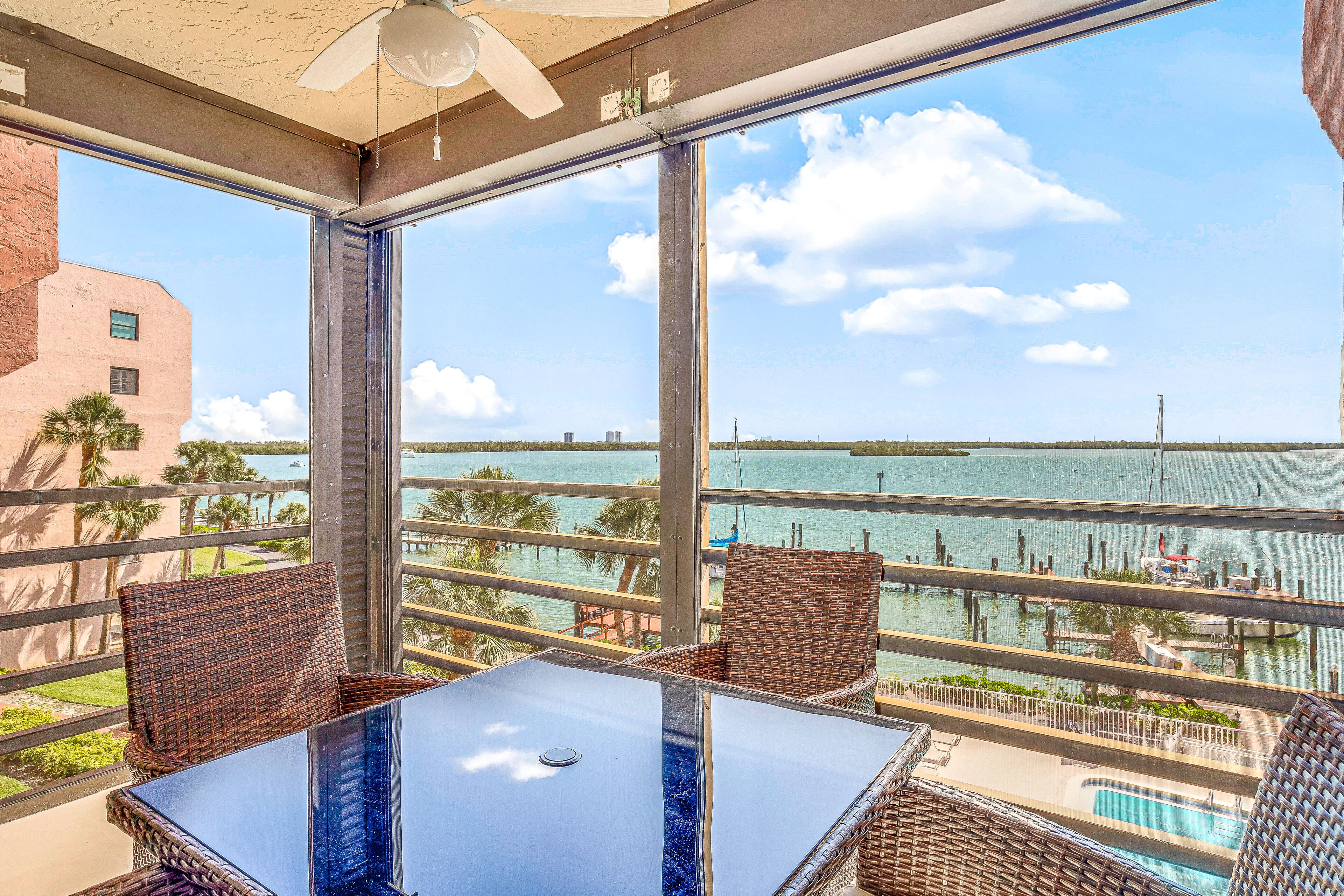 Bayfront condo with shared pool, dock, & water views - snowbird-friendly