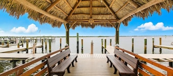 Bayfront condo with shared pool, dock, & water views - snowbird-friendly
