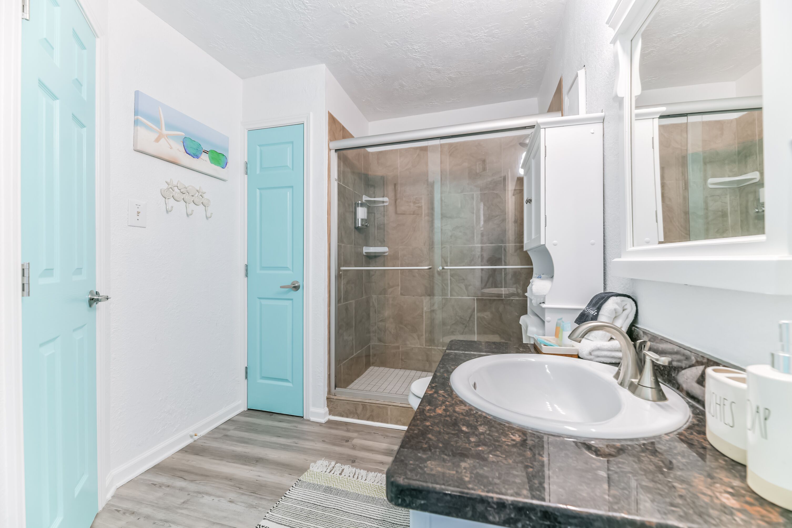 Shower, hair dryer, towels