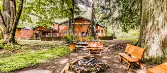 Dog-friendly creekside home with entertainment barn, private hot tub & firepit