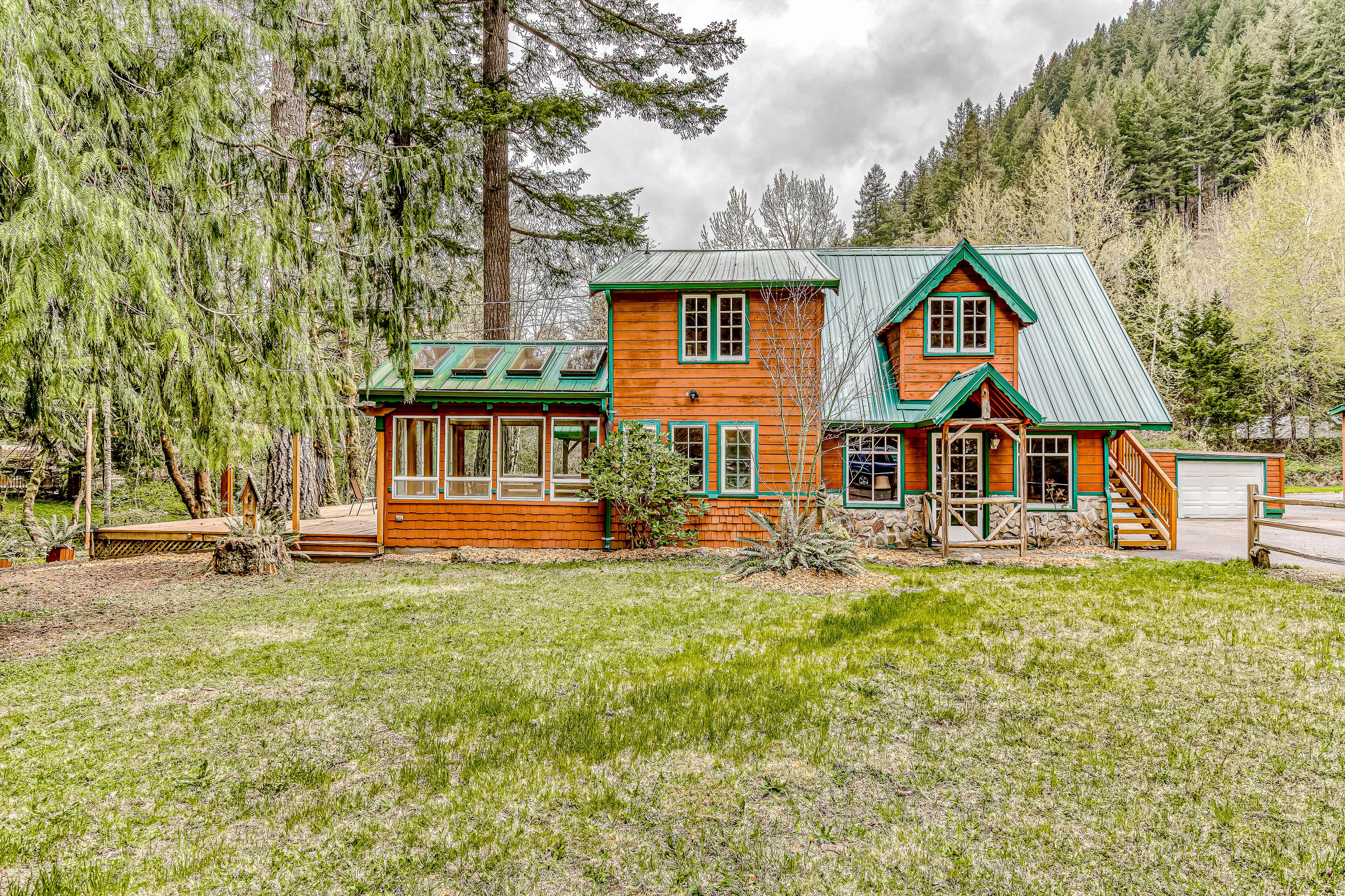 Dog-friendly creekside home with entertainment barn, private hot tub & firepit