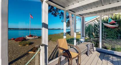 Waterfront home with panoramic bay views, deck, fireplace & beach access