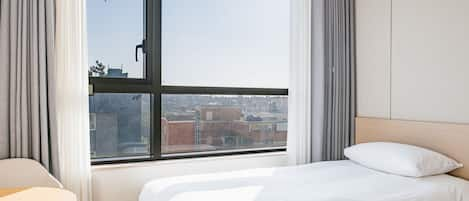 Deluxe Twin Room | In-room safe, blackout curtains, free WiFi, bed sheets