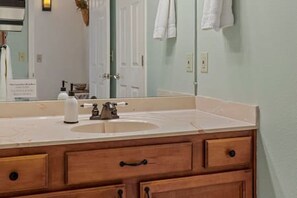 Combined shower/tub, towels, soap, shampoo