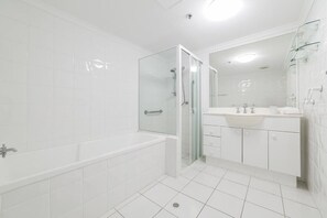 Separate tub and shower, free toiletries, hair dryer, soap
